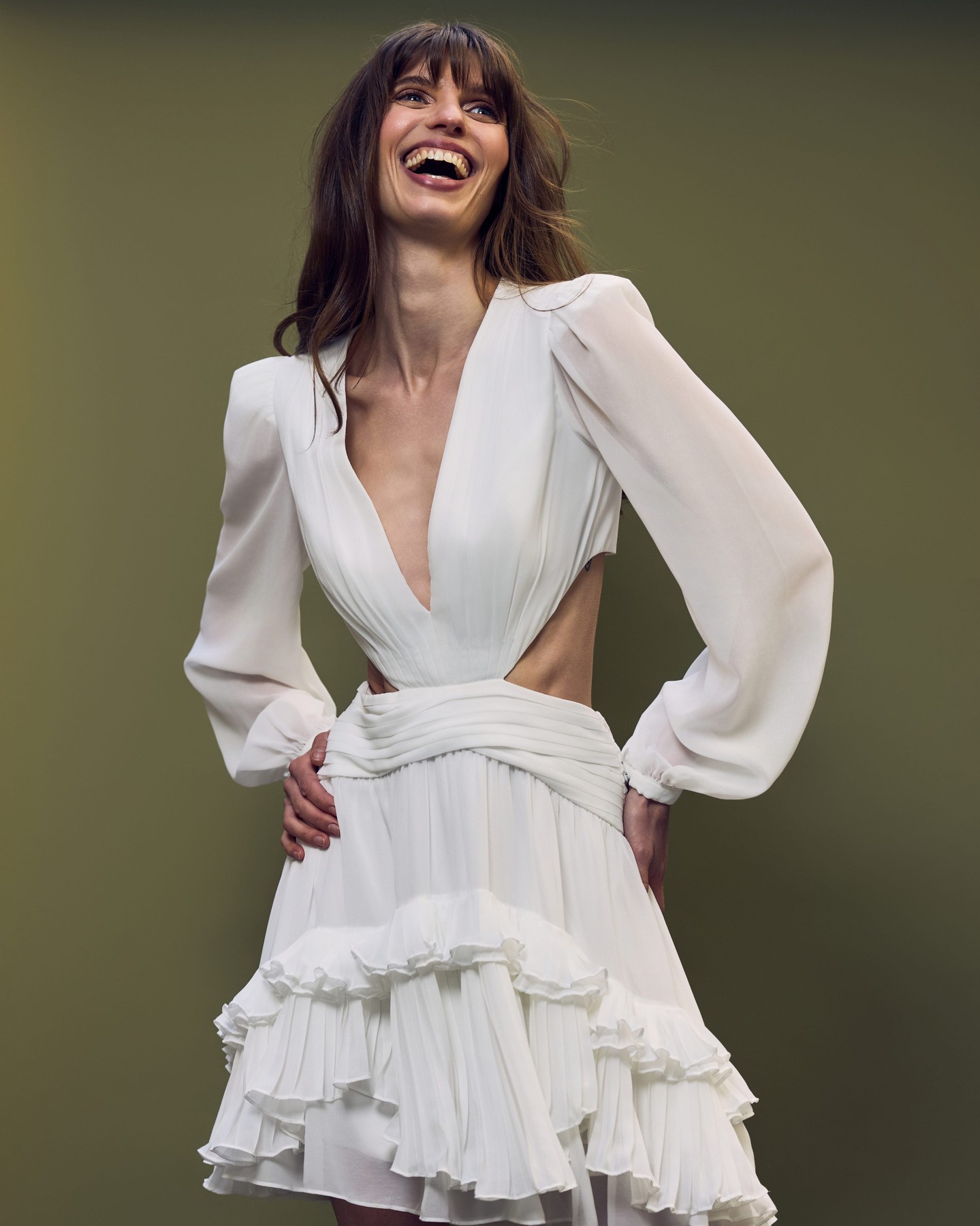 The model laughing in a ruffled PatBO mini