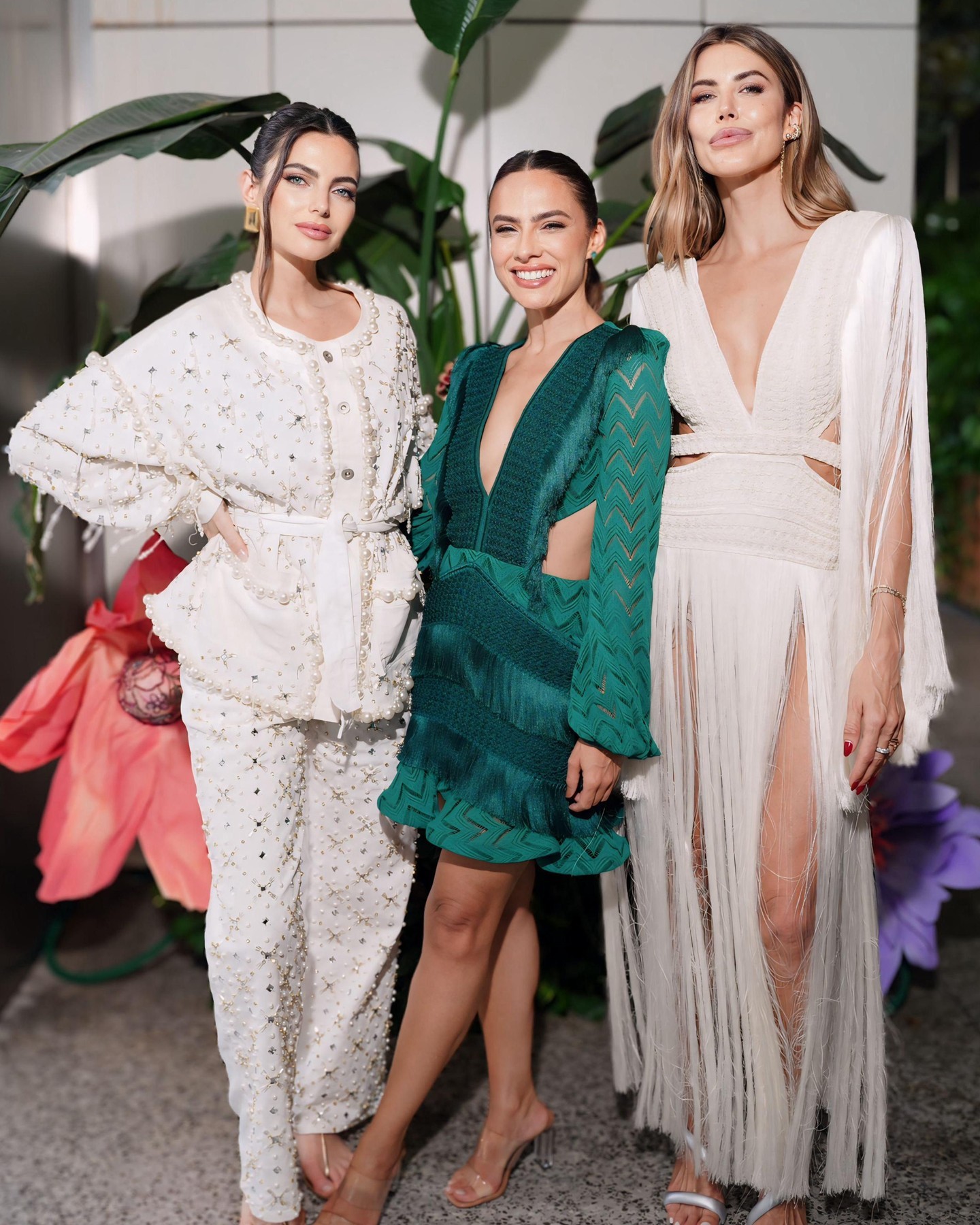 Three guests in PatBO against the tropical florals