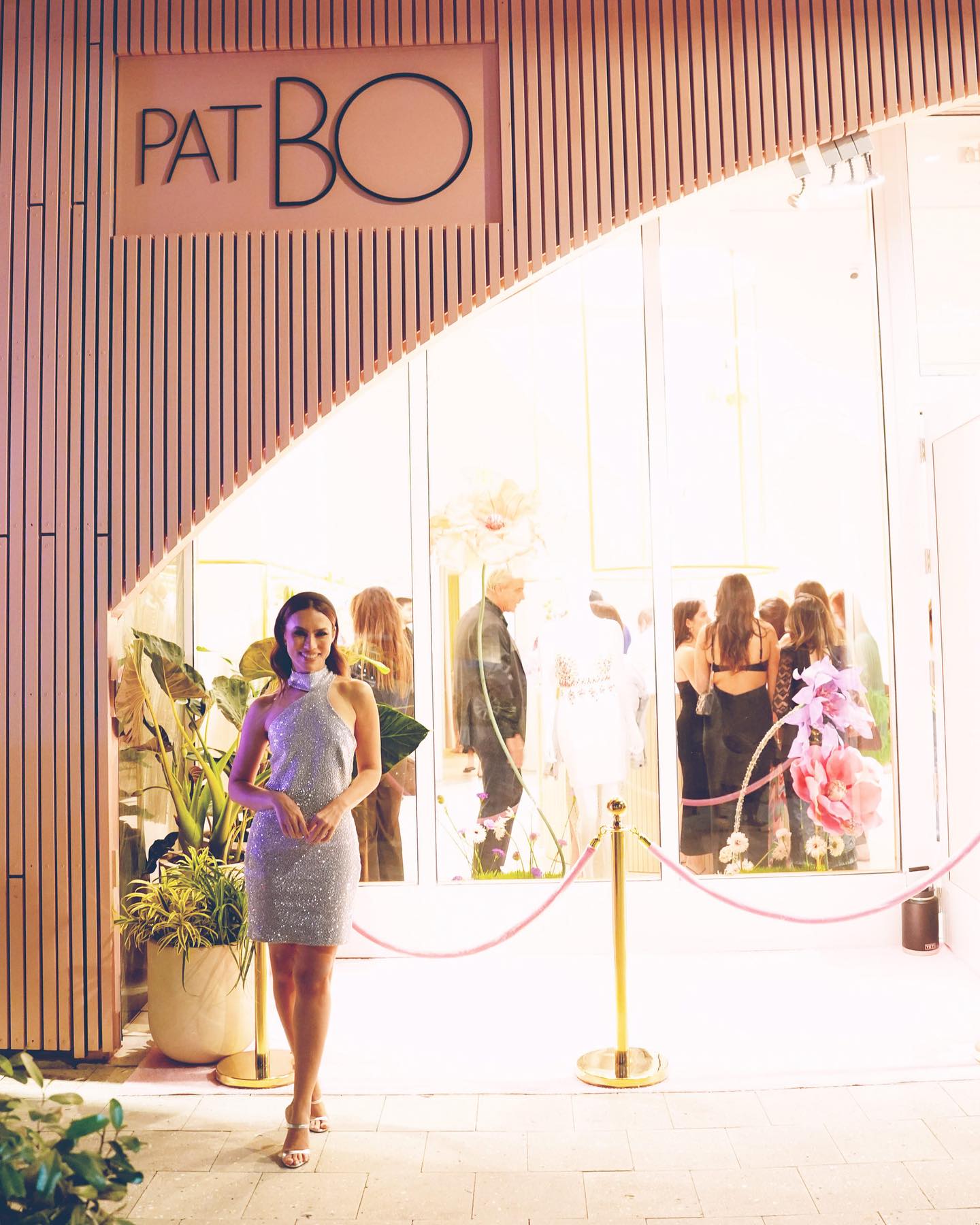 The pink slatted PatBO facade on opening night, guests inside