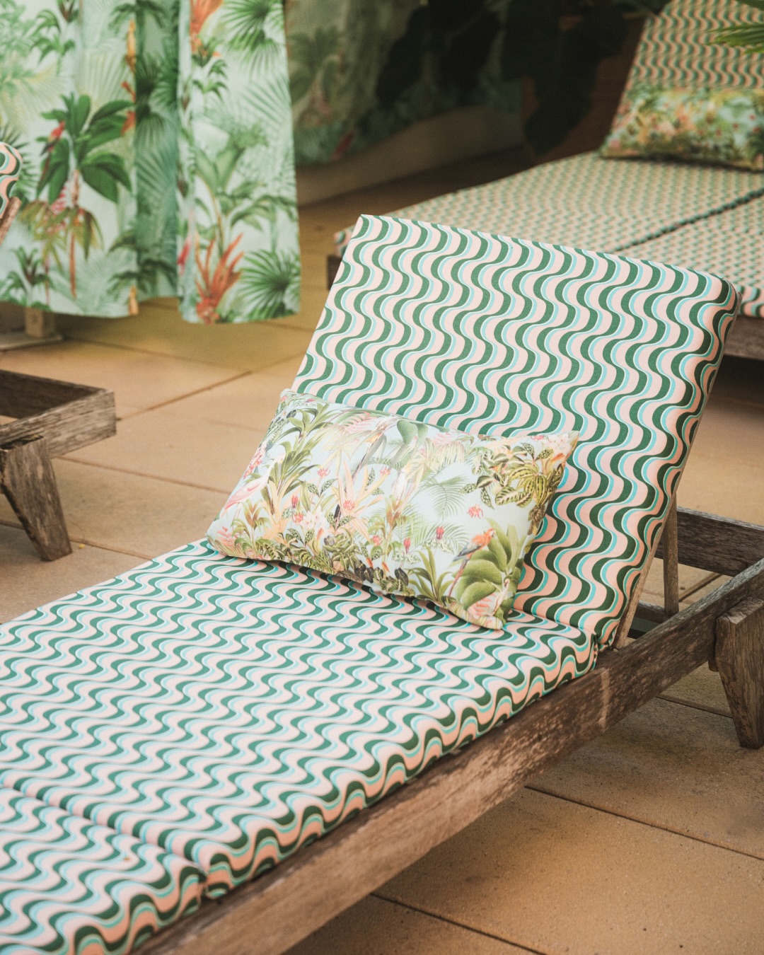 Lounger cushion and Paradise print pillow, up close