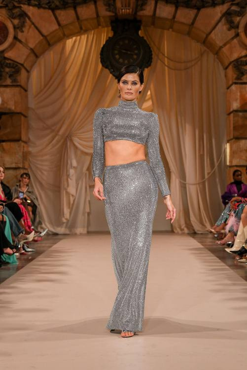 PatBO runway show at New York Fashion Week, model in a silver gown