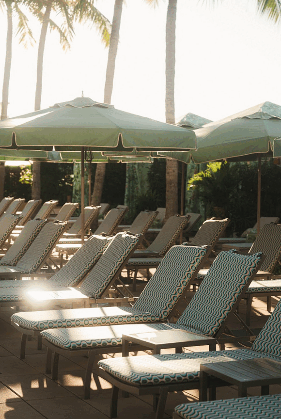 Rows of loungers and umbrellas in PatBO print at the Four Seasons Miami pool