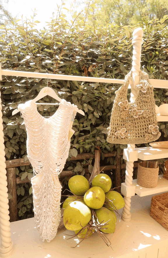 Crochet pieces hanging at the beach pop-up