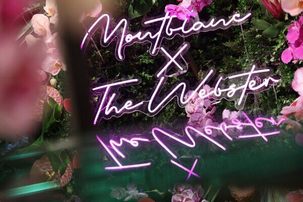 Montblanc x The Webster neon sign among florals