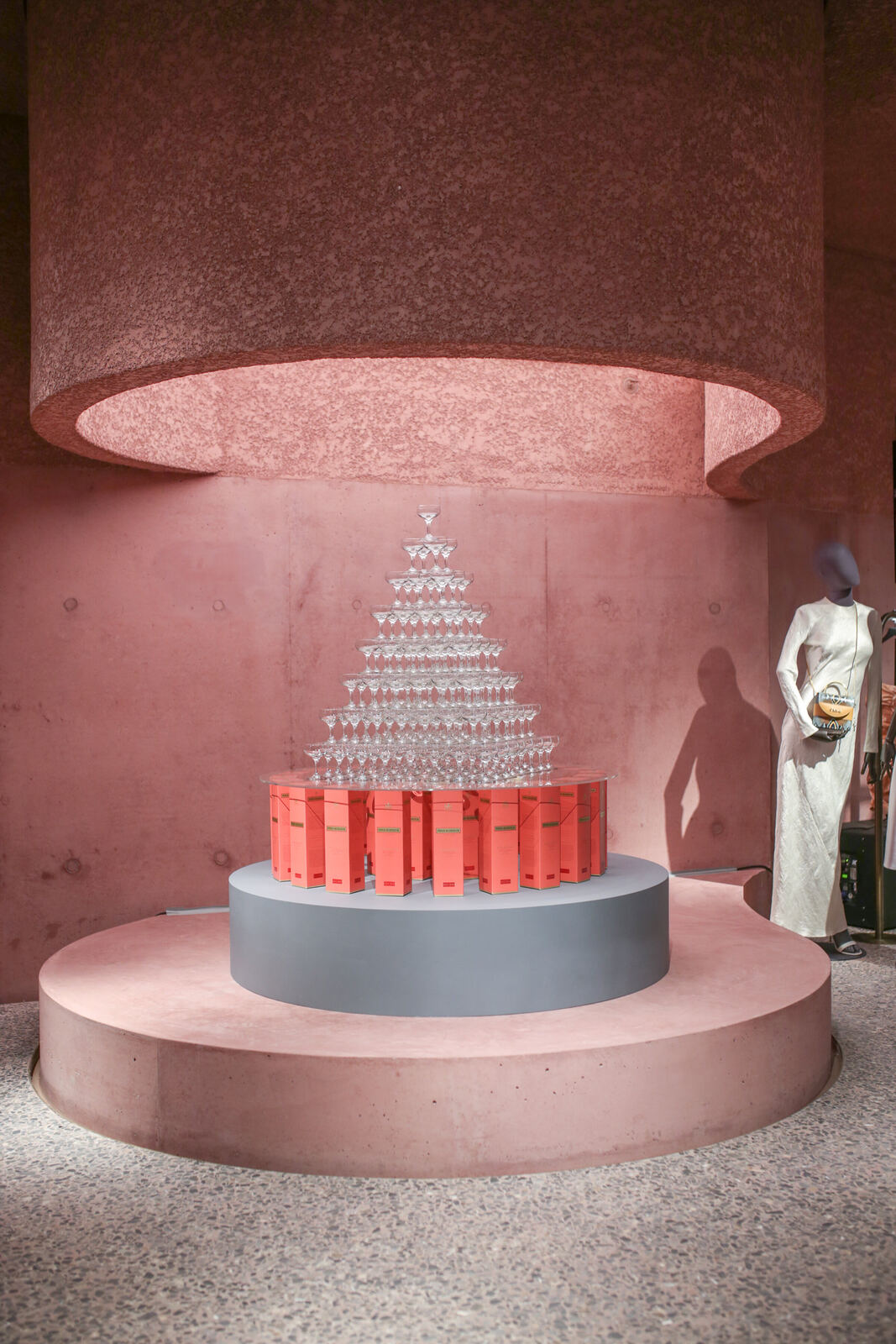 Celebration cake on a pedestal in the pink interior