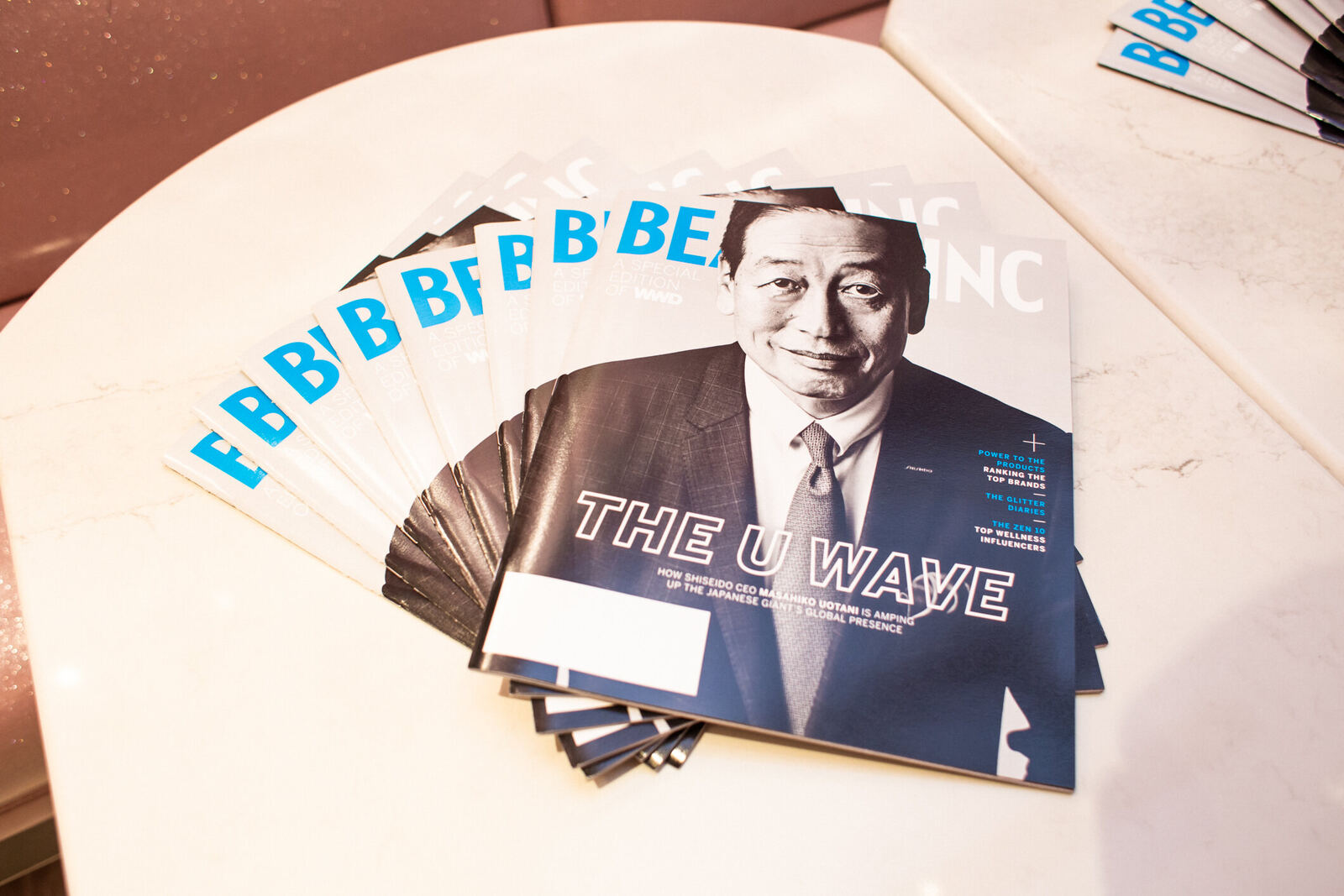 Beauty Inc magazines fanned on a table