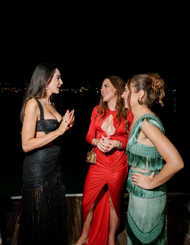 Guests in PatBO in conversation on deck at night