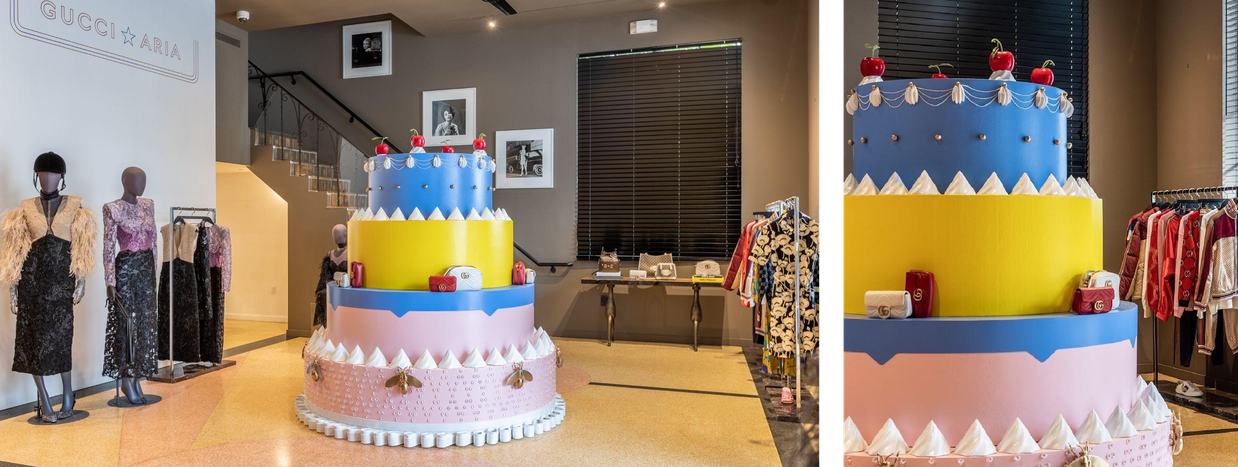 The Gucci Aria cake installation with styled mannequins in the store